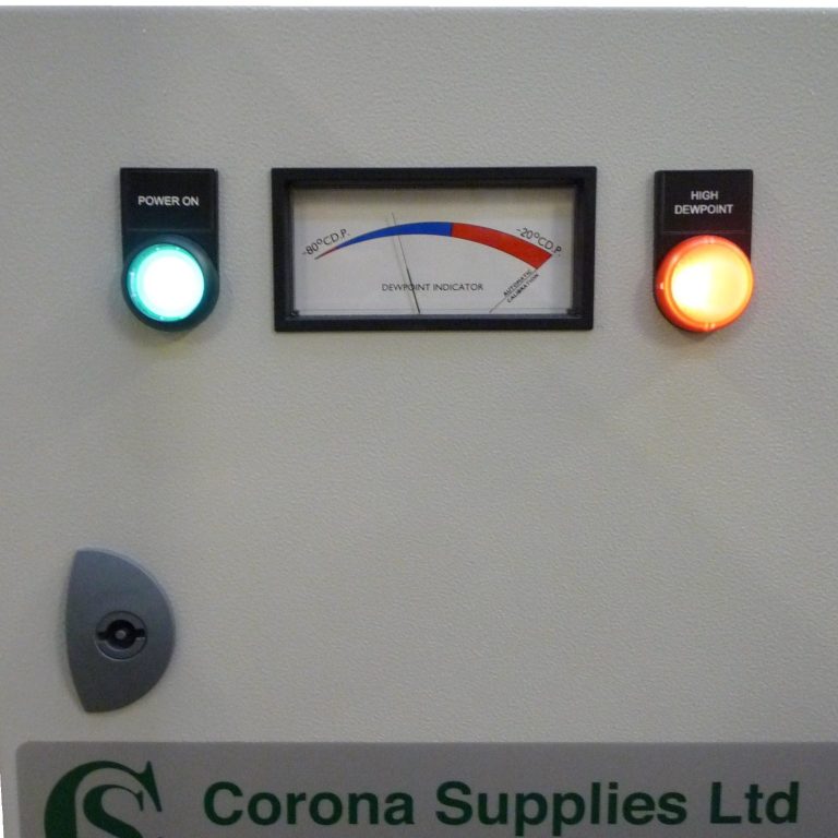 Dew point monitor with green and red indicator lights and a gauge.