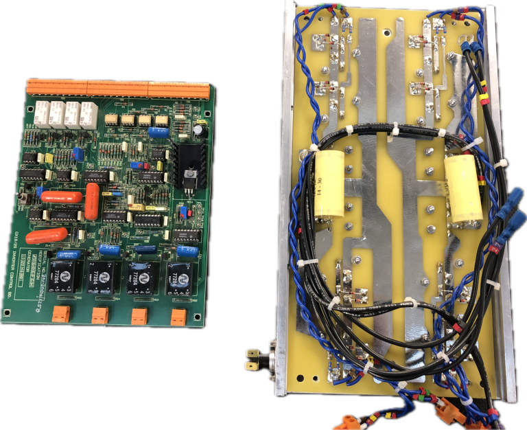 Two electronic circuit boards with various components and wiring.