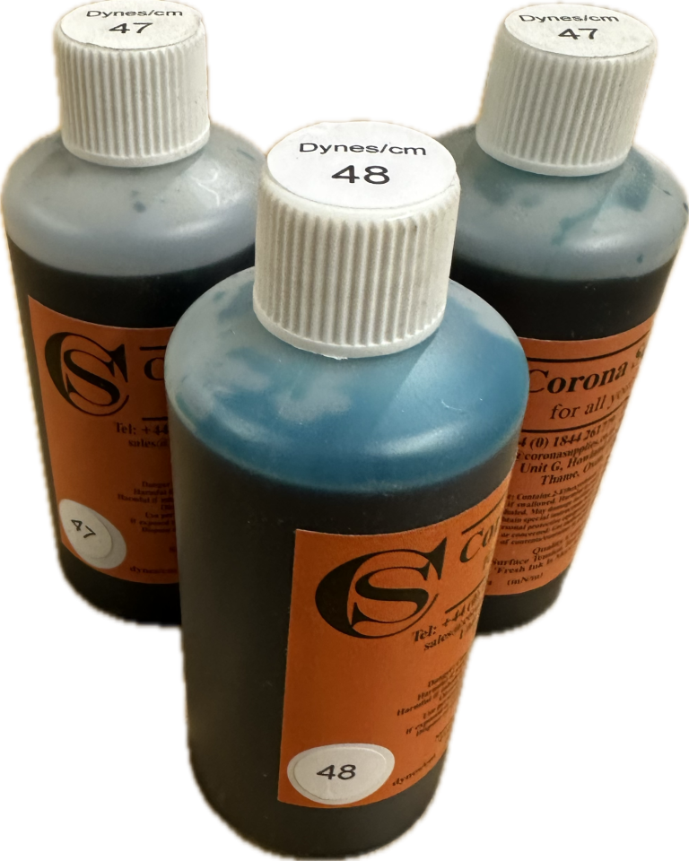 Three bottles of blue test ink  with white caps and orange labels.